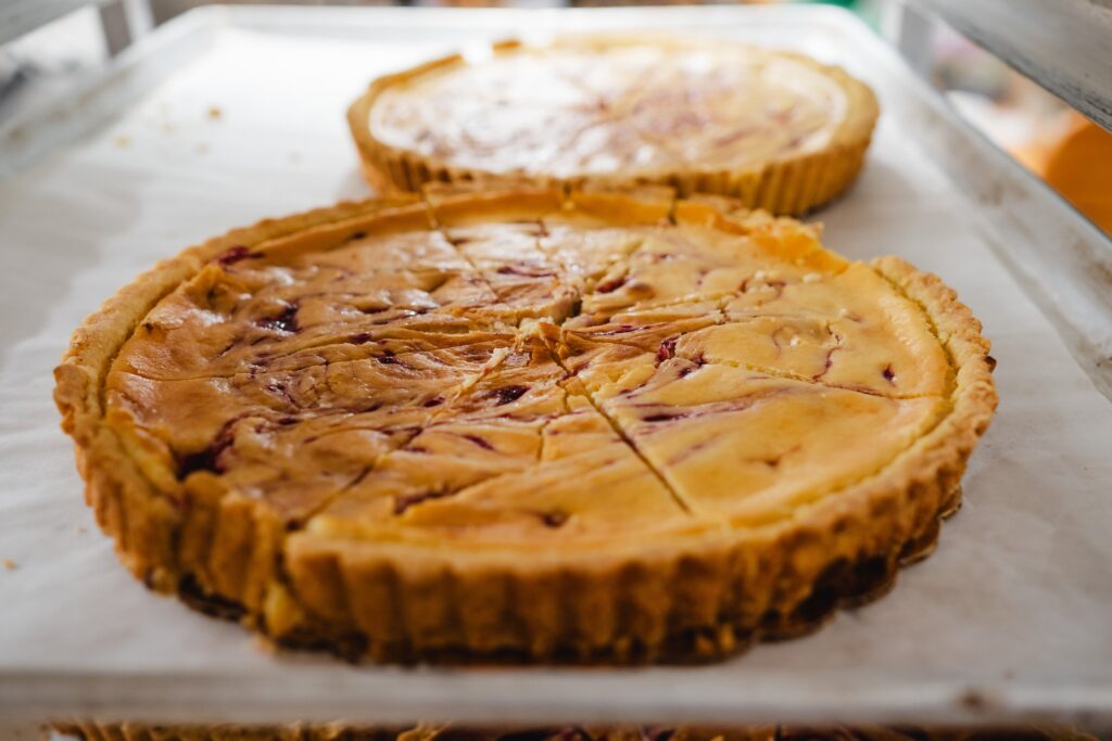 Two whole tartlets, sliced and ready to serve.